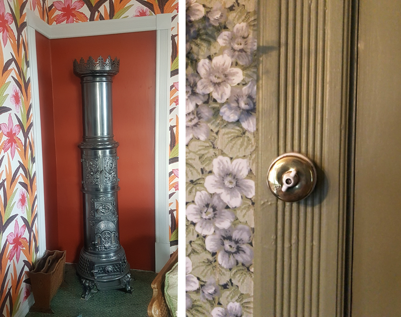 kakkelovn og lysbryter blant fine tapeter