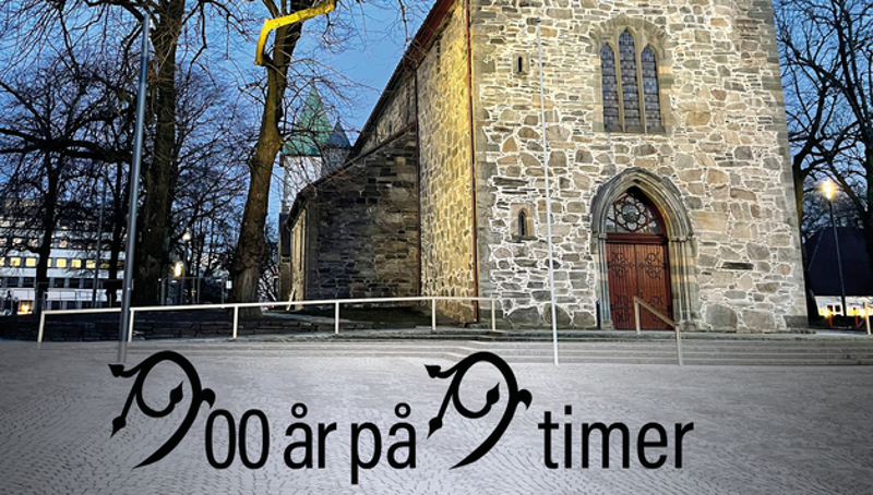 Plakat med bilde av domkirken med teksten 900 år på 9 timer