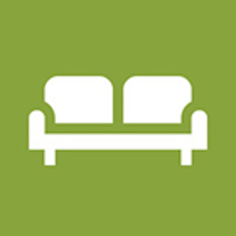 Piktogram for grovavfall, hvit sofa på grønn bakgrunn