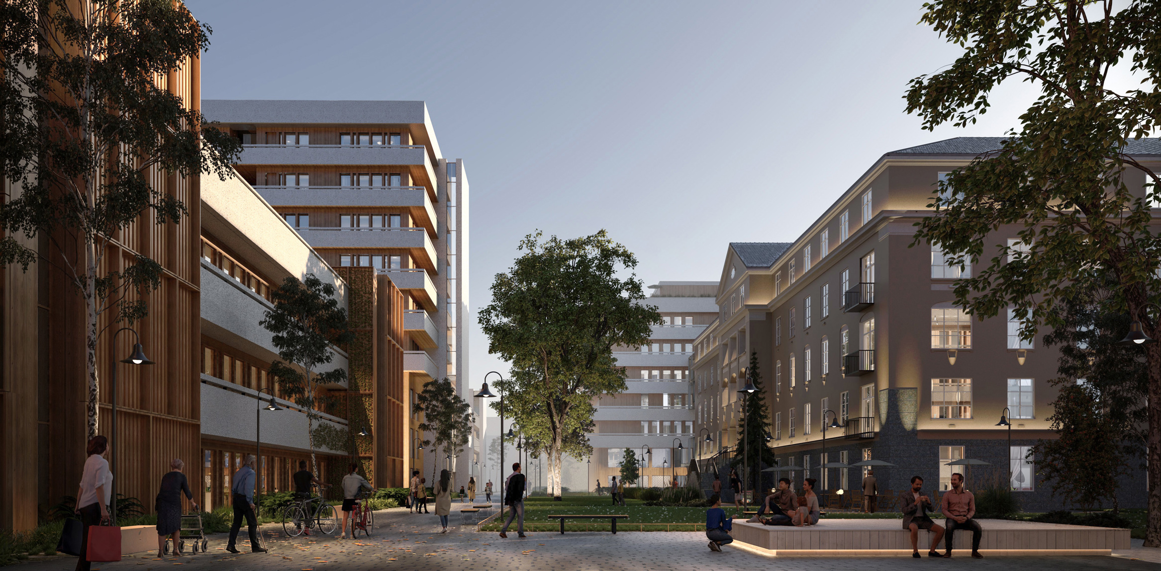 Blanding av nye og gamle bygg, med torg, park og stort tre i midten.